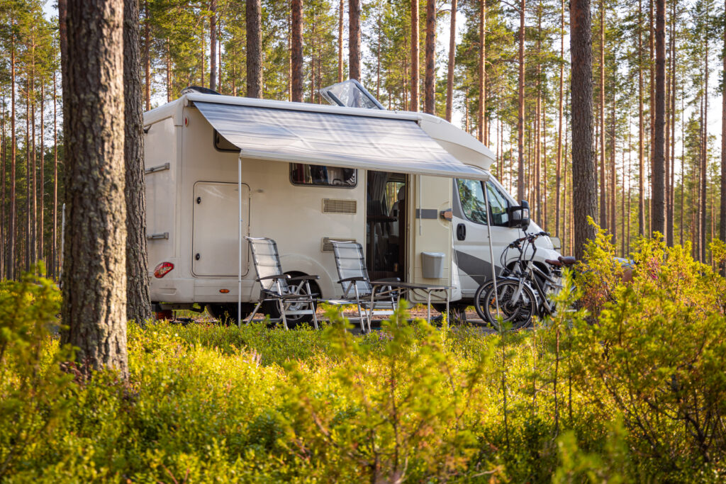 Camping trailer setup in the woods